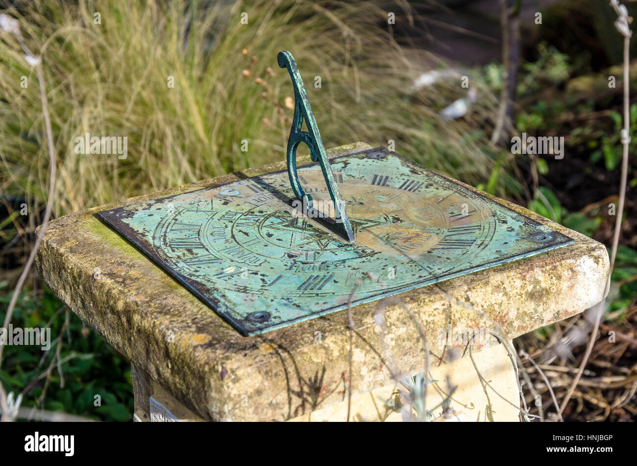 A sundial in a garden Stock Photo Alamy