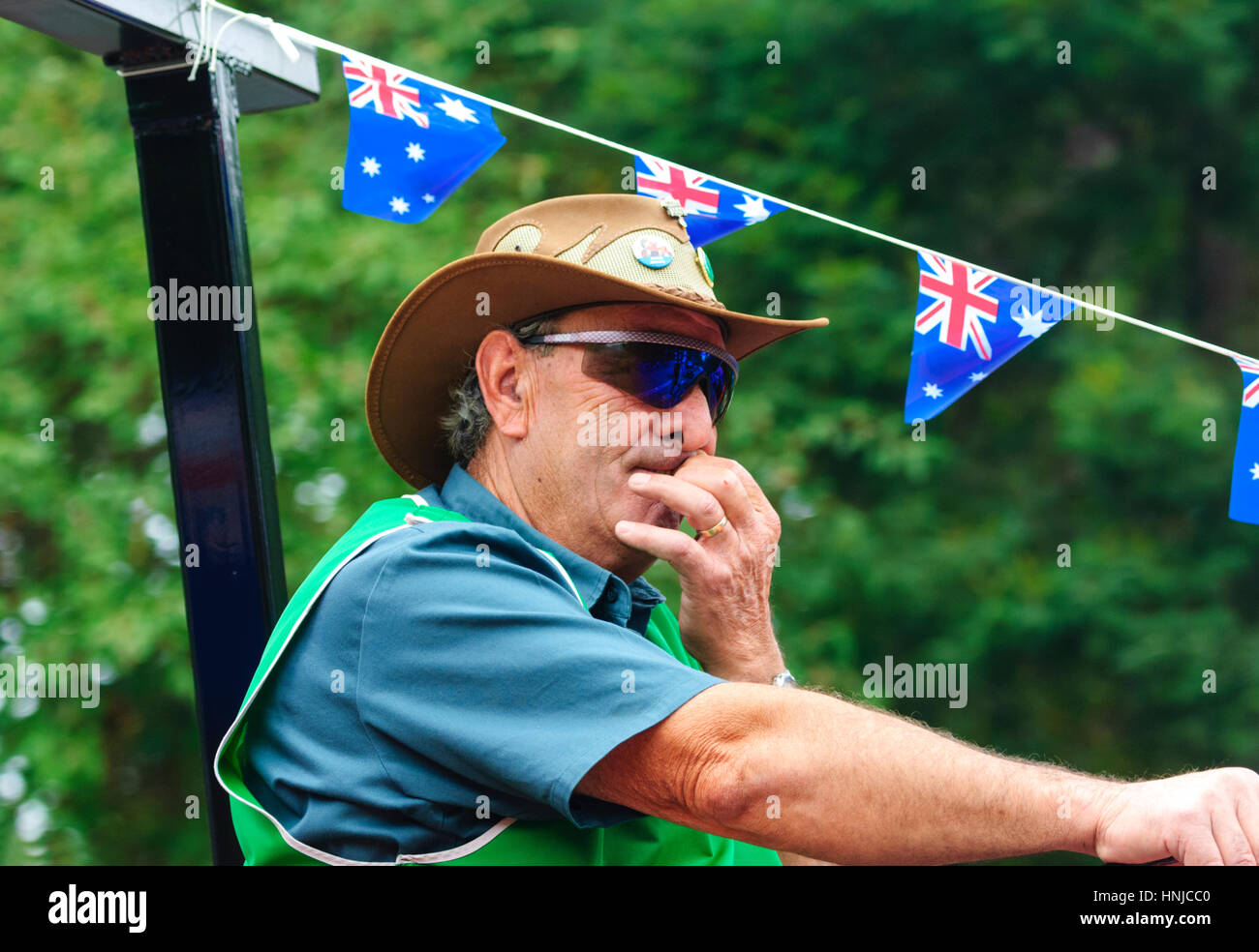 Pensive man with a hat and sunglasses participating in the Australia Day 2017 parade, Berrima, New South Wales, NSW, Australia Stock Photo