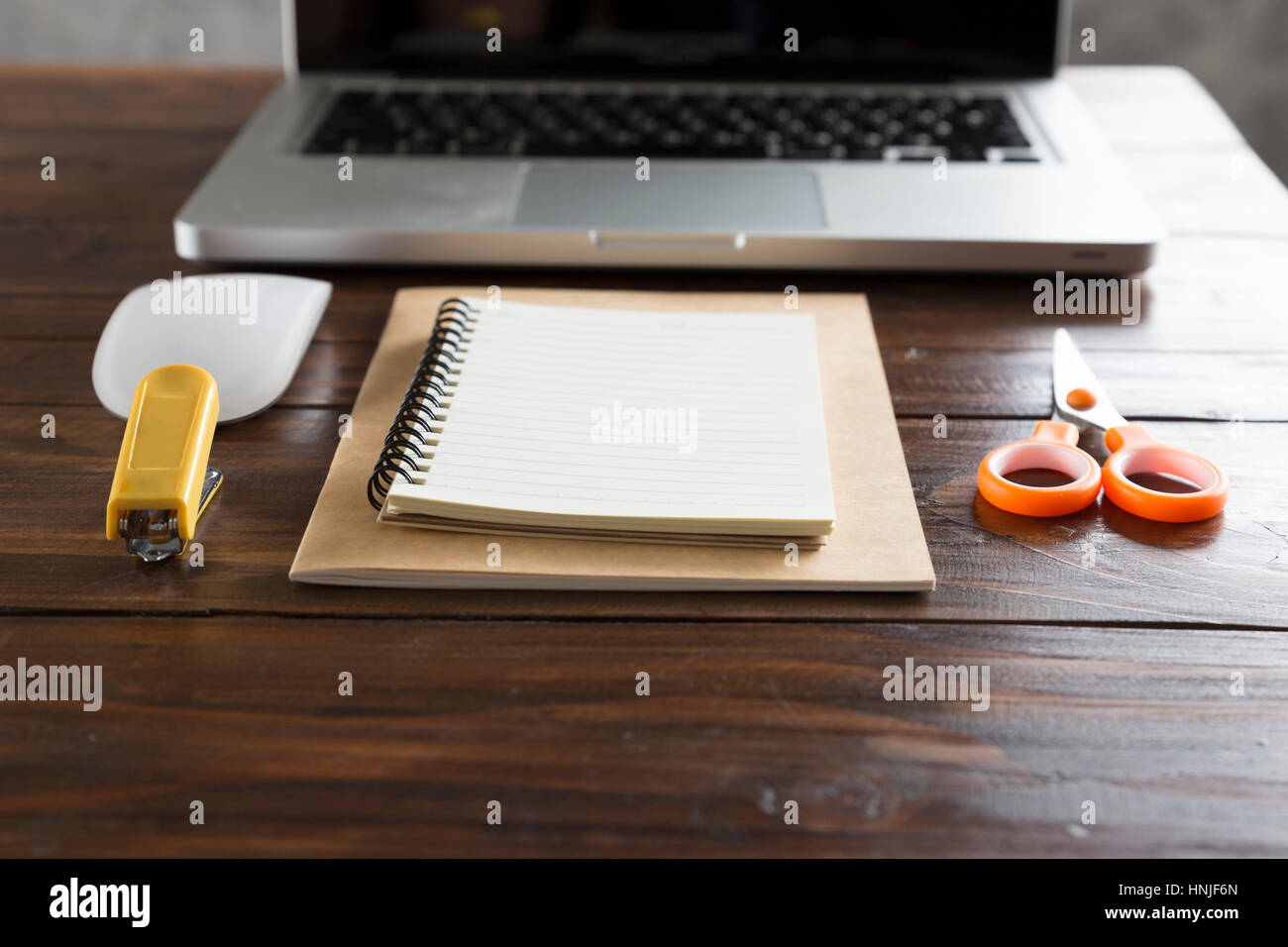 laptop computer and notebook on wooden office desk Stock Photo - Alamy