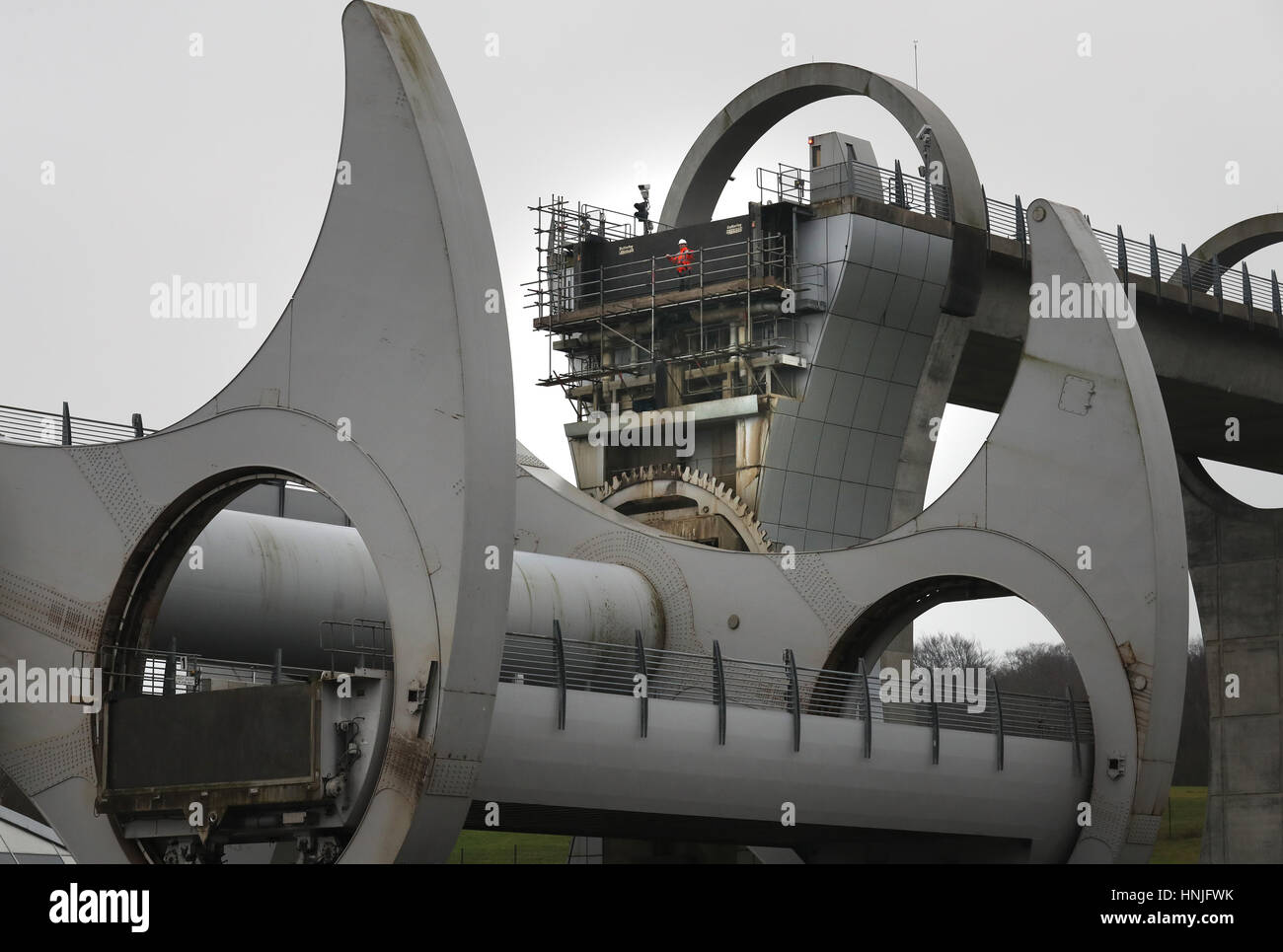 Viktor Juhasz Scottish Canals maintenance technician views the Falkirk Wheel from the fixed gate, as the second phase of winter maintenance on the world's only rotating boat lift is currently underway, with Scottish Canals engineers de-watering the structure in order to replace the gate bearings, with the attraction reopening to boat trips on March 8th. Stock Photo