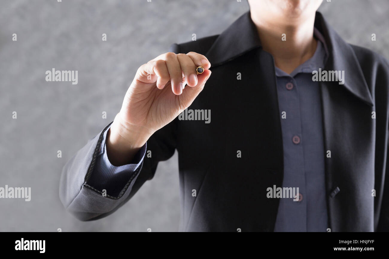 gesture of businessman hand holding pen writing something for use as ...