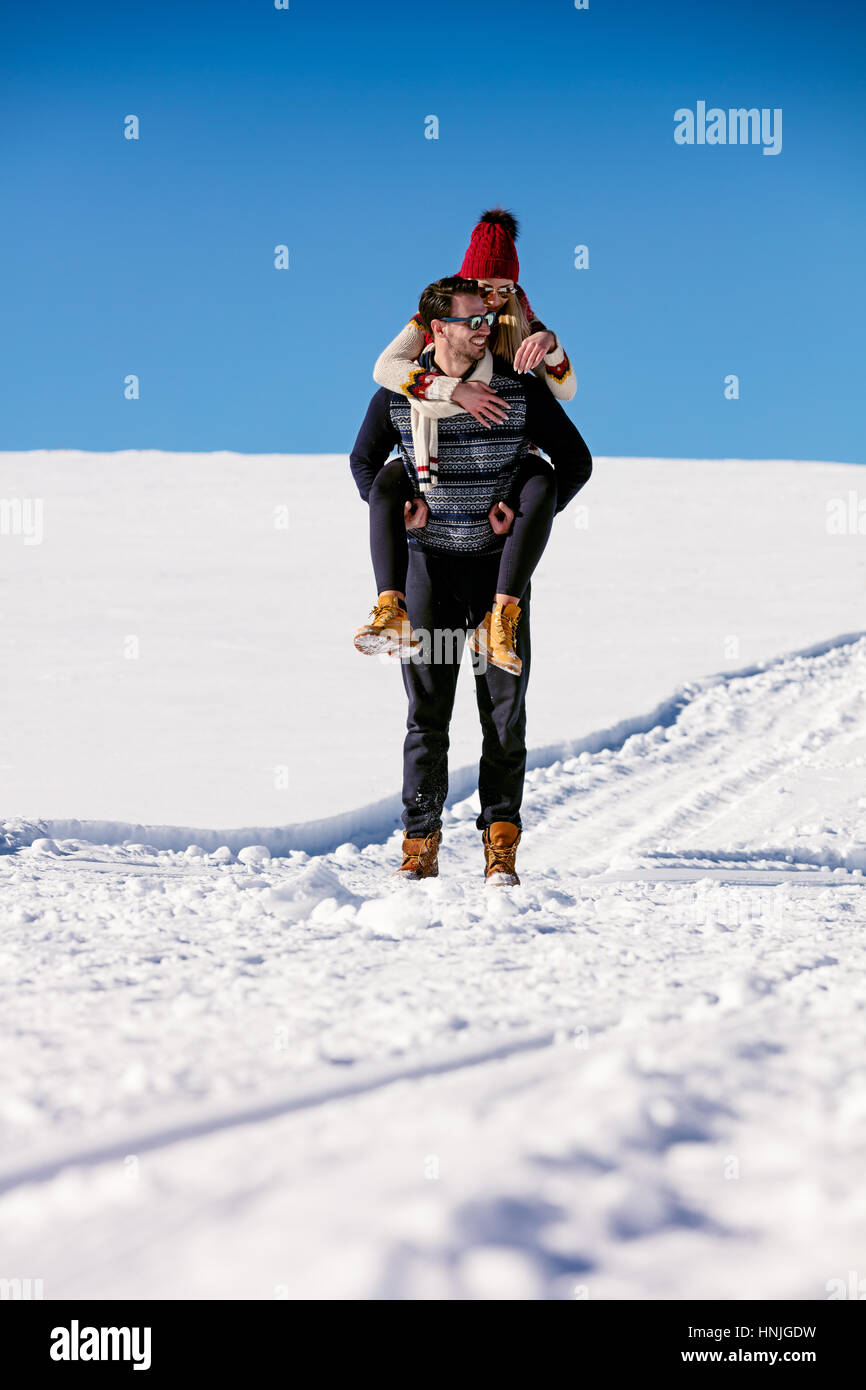 Teenage girl giving friend piggyback ride Stock Photo - Alamy