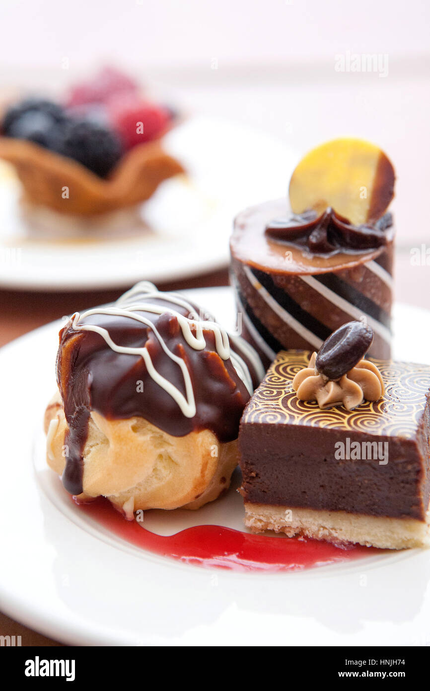 Delicious chocolate desserts with a raspberry sauce on a plate Stock Photo