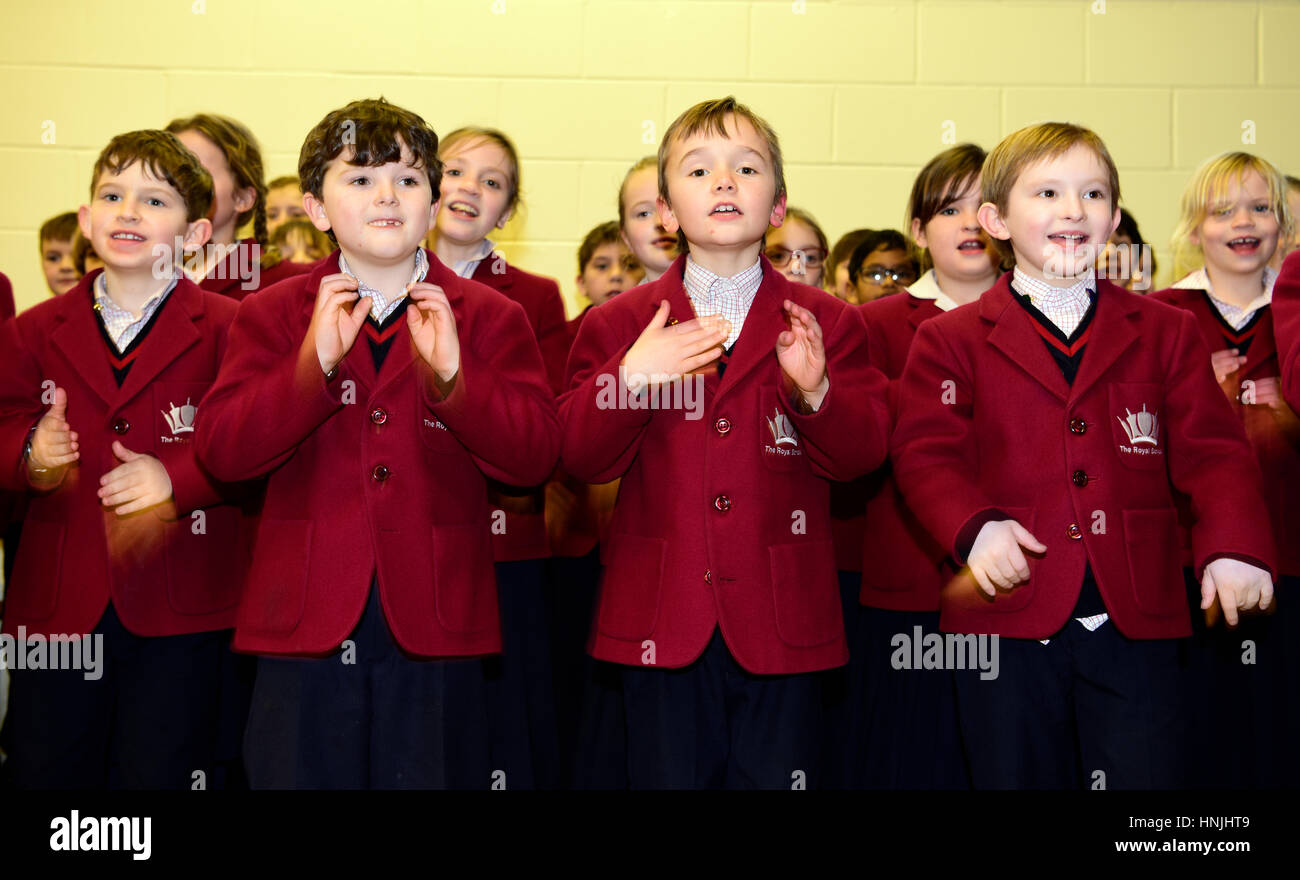 Junior school pupils performing a singalong for their grandparents at a school open day, Hindhead, Surrey, UK. Stock Photo