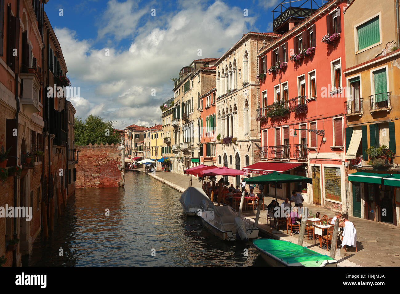 Channels ( Canal ) and streets of Venice. The city has attracted a lot of tourists in this month of the year. Stock Photo
