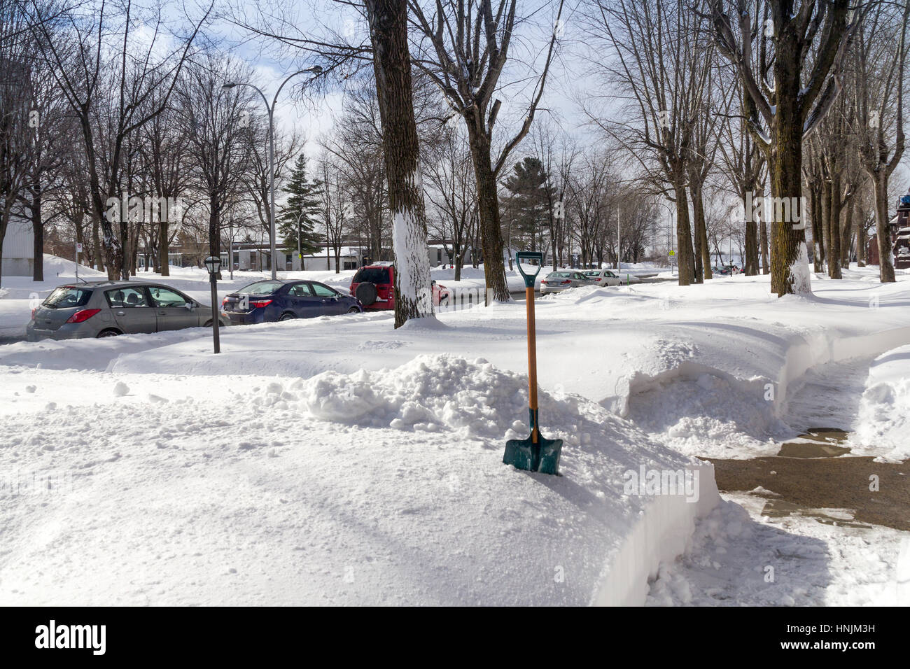 Sorel-Tracy, Canada-13 February 2017 : Sorel-Tracy street after a snowfall in daytime outdoor with cars parked on the street. Sorel-Tracy is a small t Stock Photo