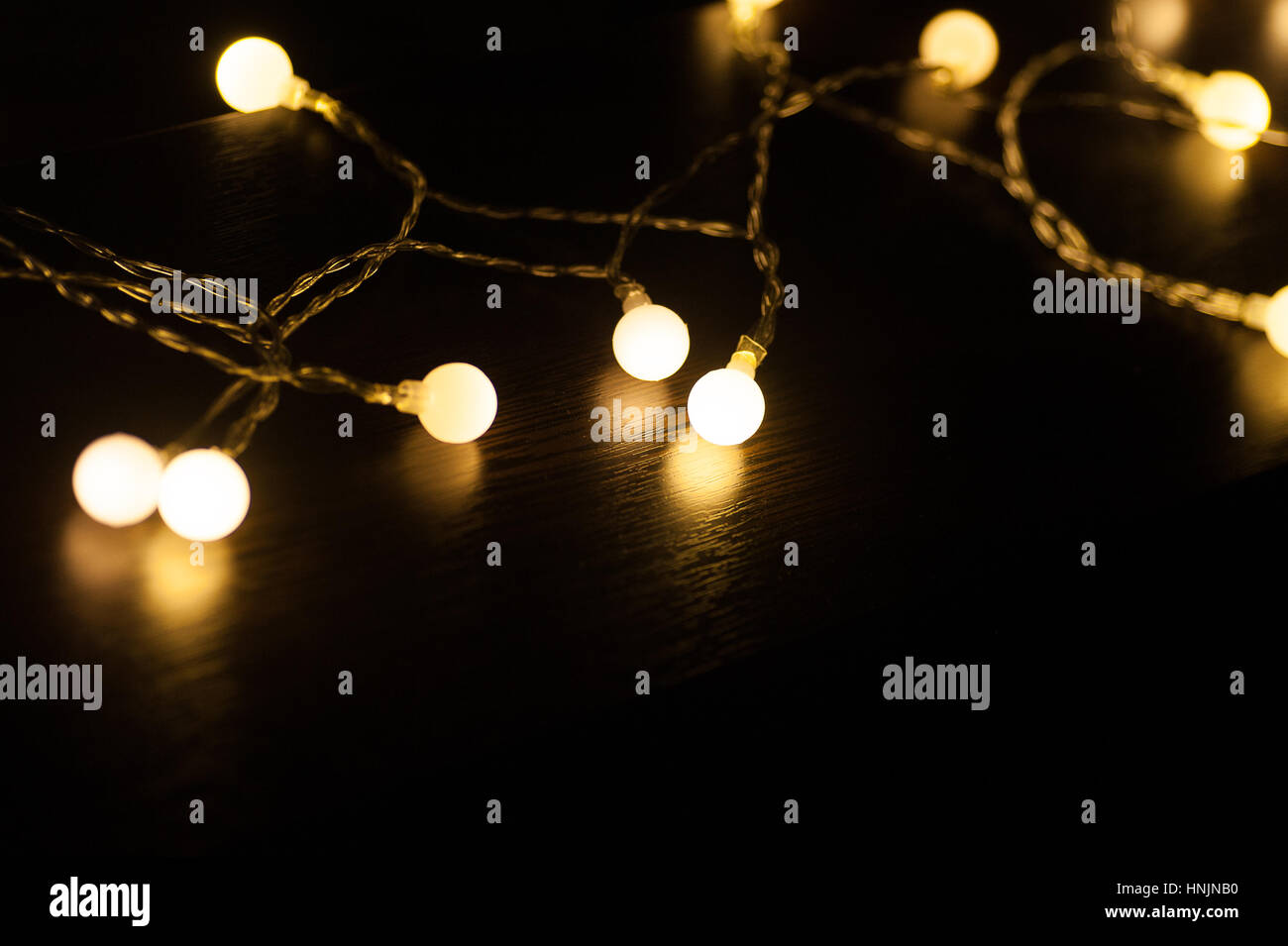 included a garland on a dark background Stock Photo