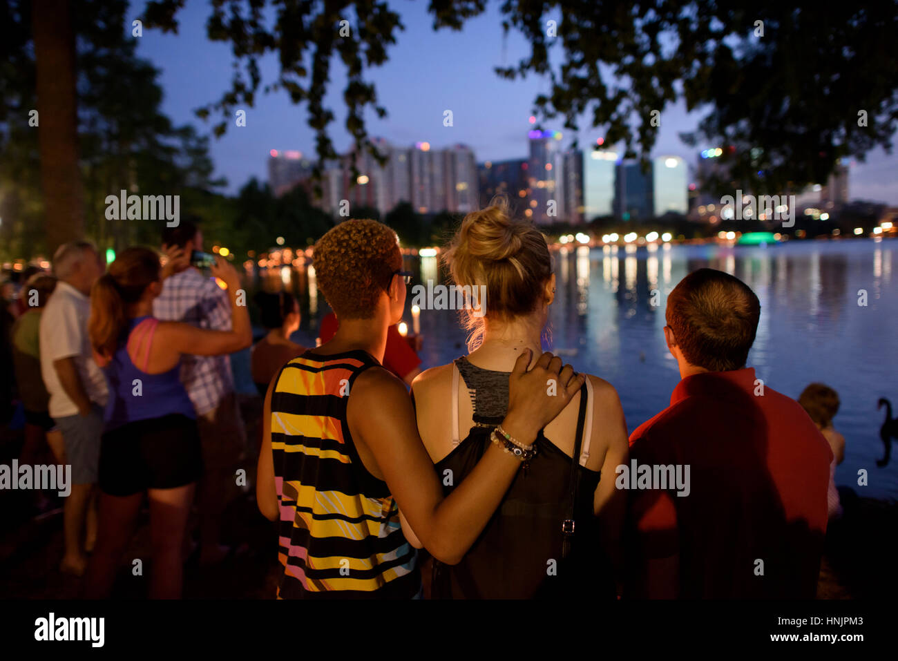 A Candlelight Vigil honored the victims of the Pulse nightclub shooting at Lake Eola Park in Orlando, Florida on June 19, 2016. Stock Photo