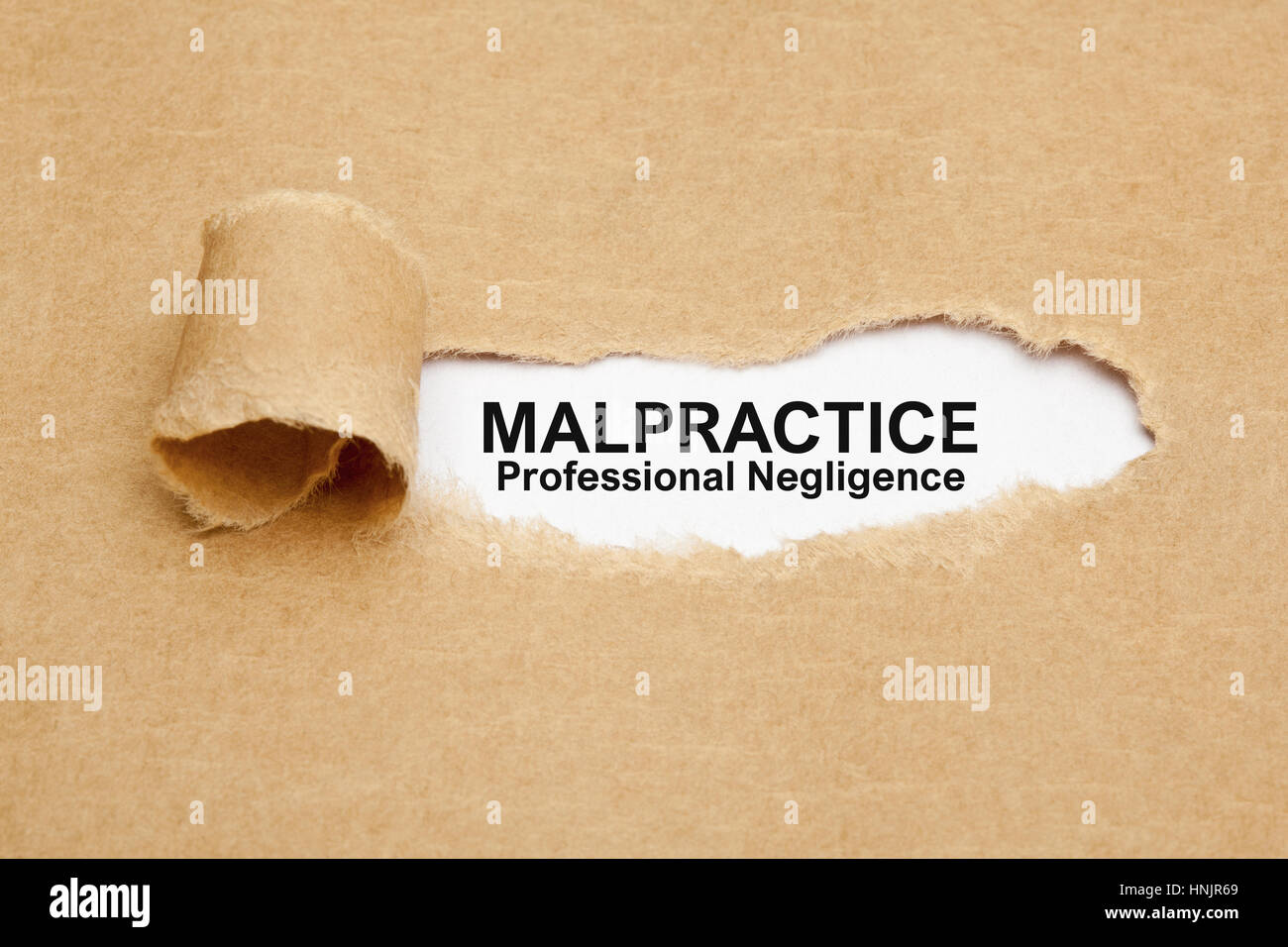 Text Malpractice Professional Negligence appearing behind ripped brown paper. Stock Photo