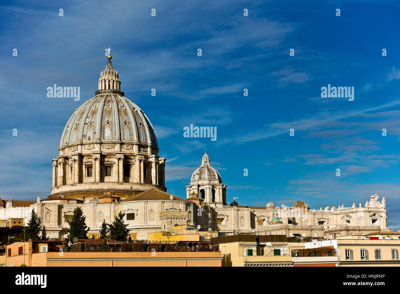 Unusual view of Saint Peter cathedral’s dome seen from the back. Cupola ...
