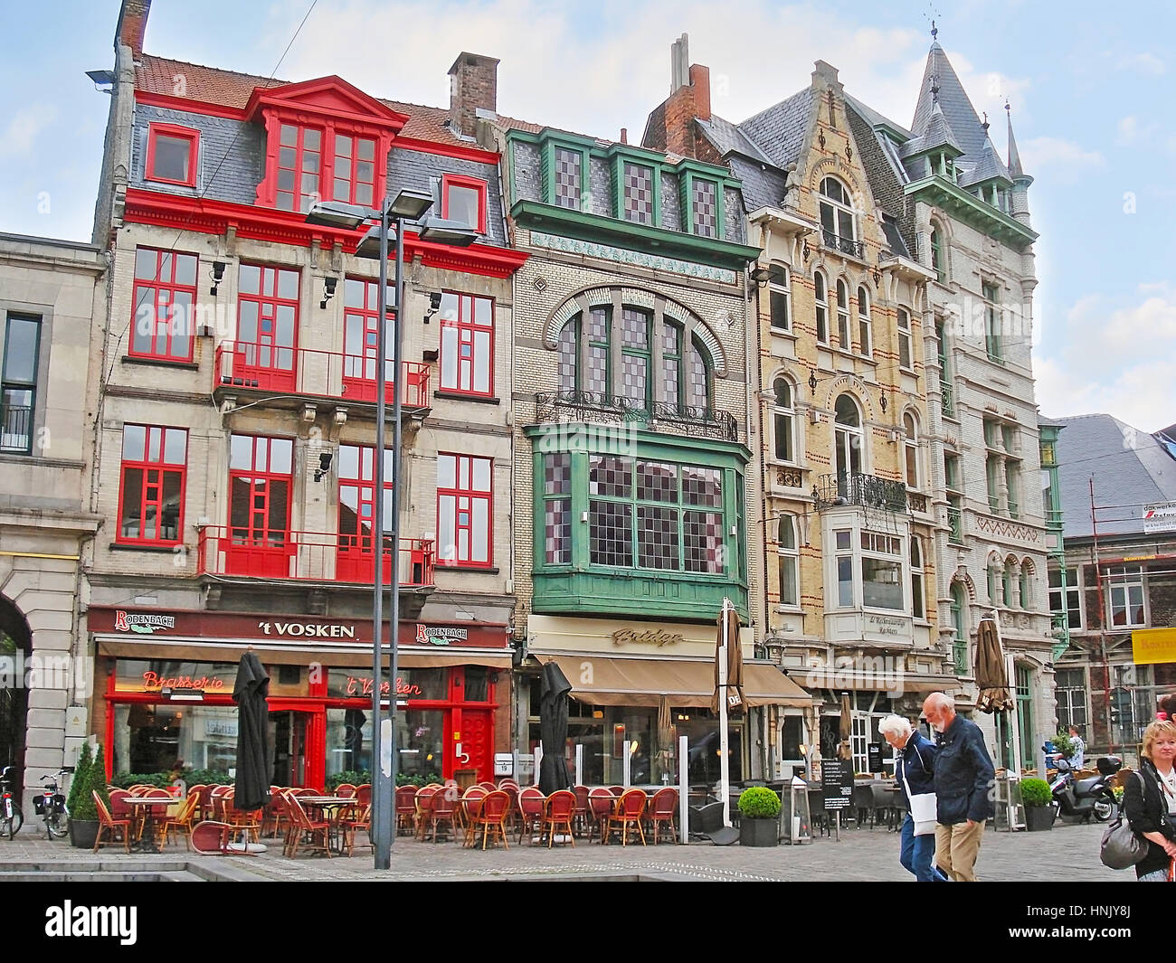 GHENT, BELGIUM - MAY 26, 2011: Sint-Baafsplein Square is full of tourist cafes and luxury restaurants to spend the time in city center and enjoy the l Stock Photo