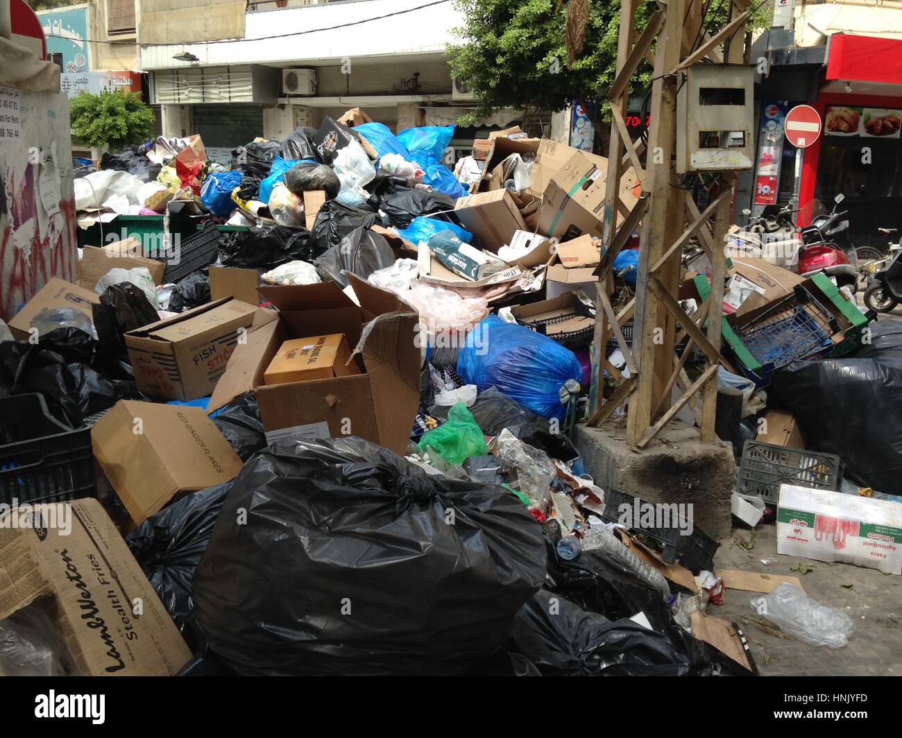 Garbage piled up on Makdesi streets in Hamra, Beirut, Lebanon one sign of Lebanese governmental corruption. Stock Photo