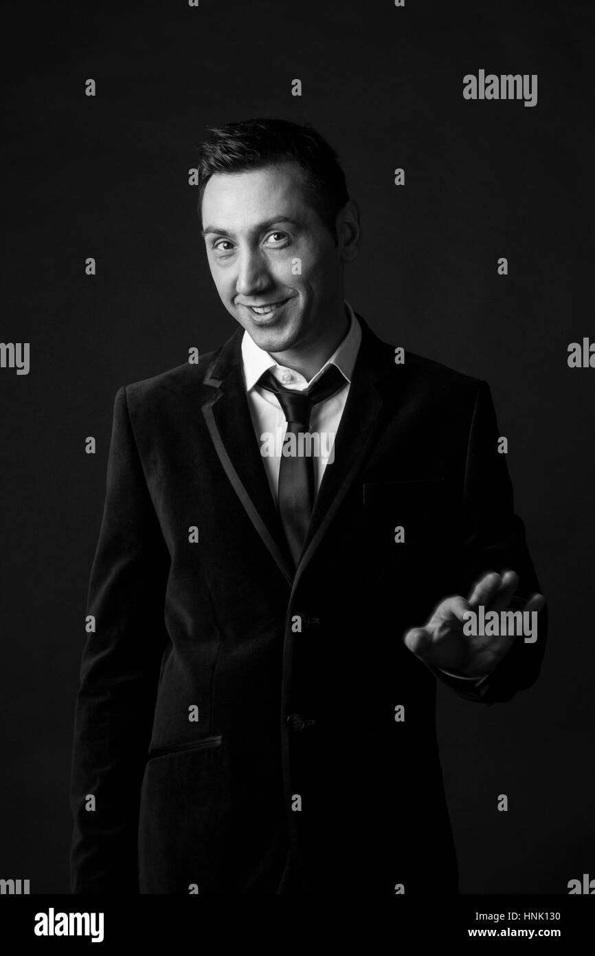 Portrait of man in his thirties on a black background Stock Photo