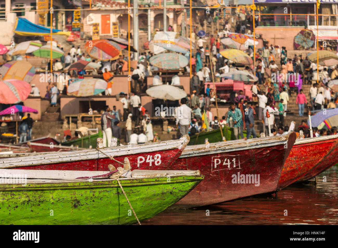 Colourful boats in the sacred water of the Ganges river. Varanasi, India Stock Photo