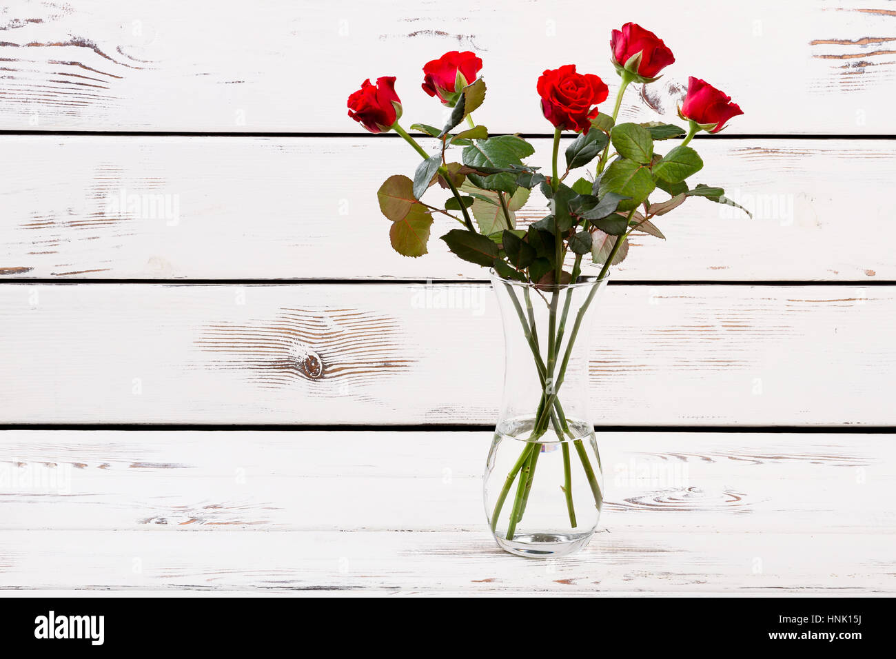 Glass vase with red roses Stock Photo Alamy