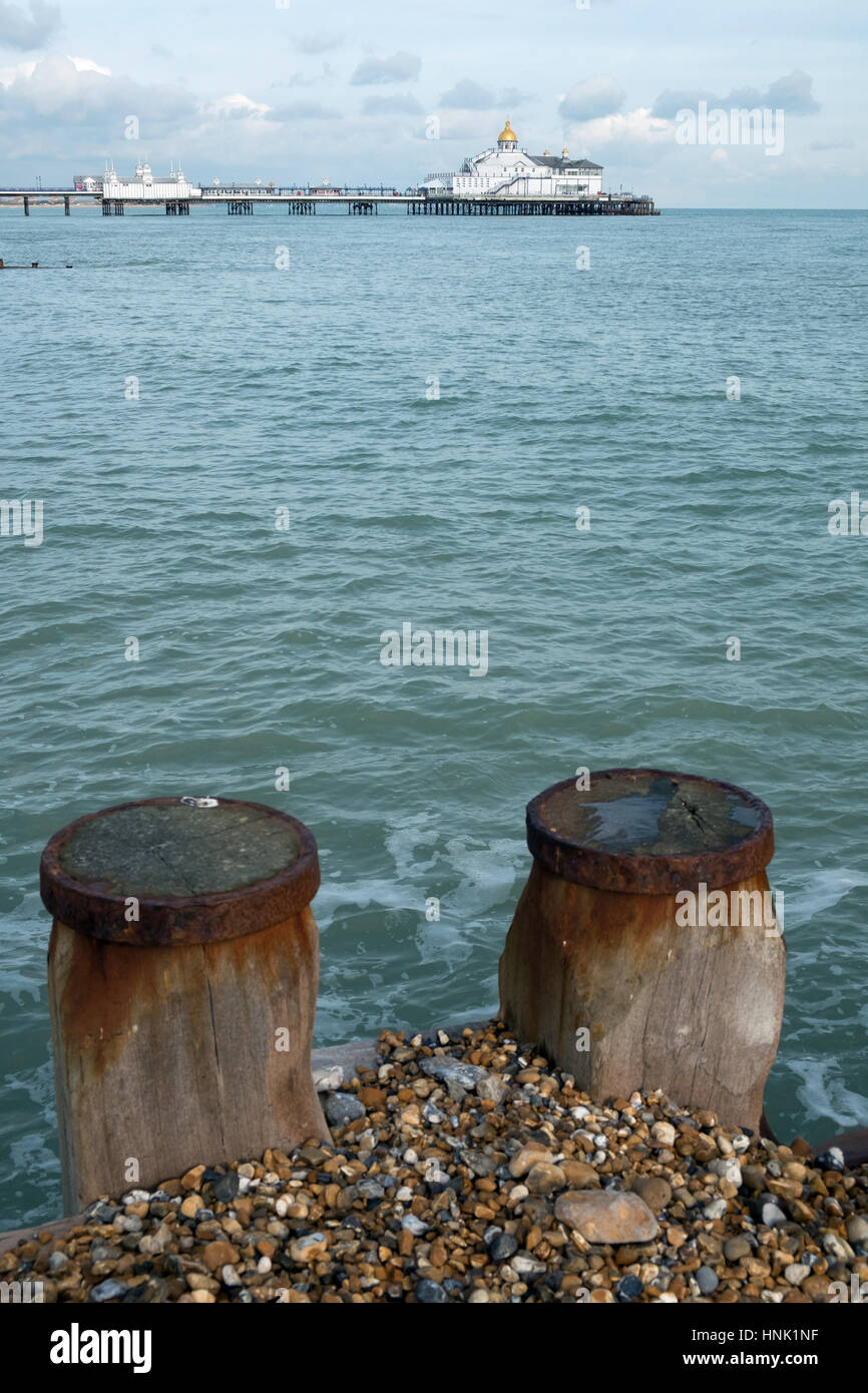Two wooden sea coastal defence timbers on Eastbourne beach with the