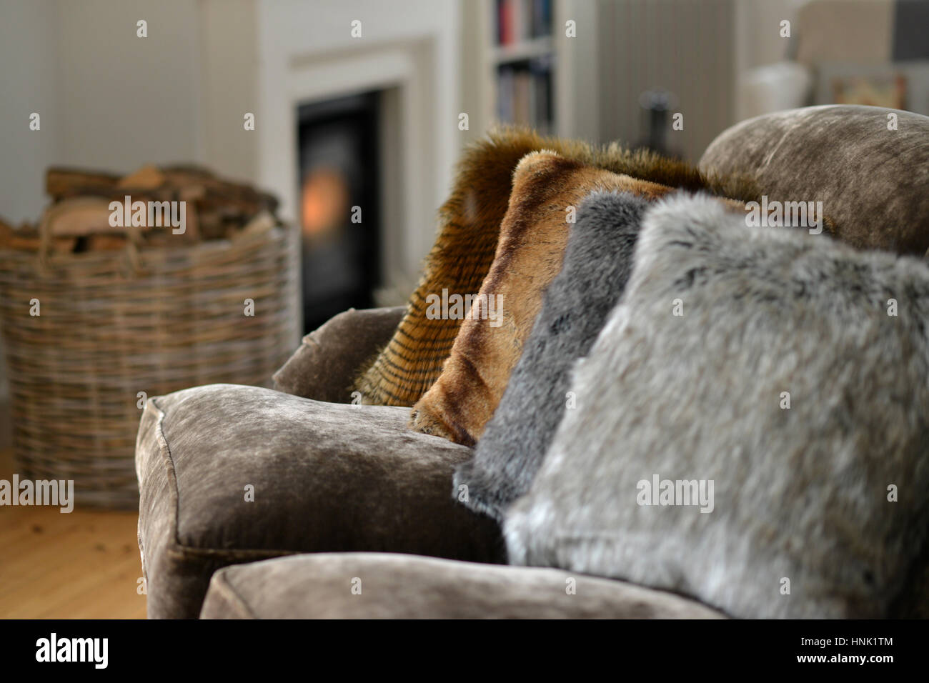 Faux fur throws and cushions room interior Stock Photo Alamy
