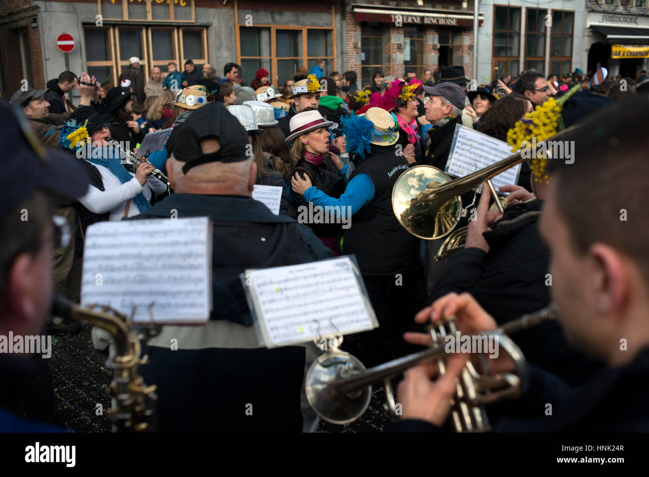 Music, dance, party and costumes in Binche Carnival. Ancient and representative cultural event of Wallonia, Belgium. Stock Photo