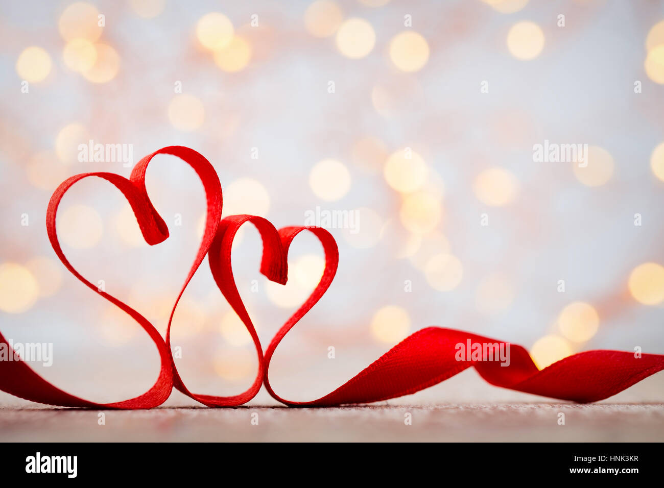 Two red hearts of ribbon. Valentines day greeting card Stock Photo - Alamy