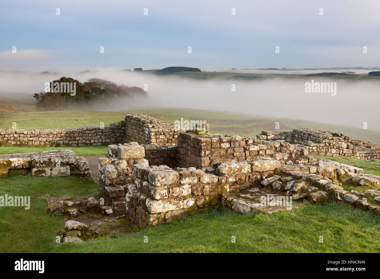 Hadrian's Wall, Housesteads Roman Fort:  the remains of a small bathhouse in the south-eastern corner of Building 15 on a misty autumnal day Stock Photo