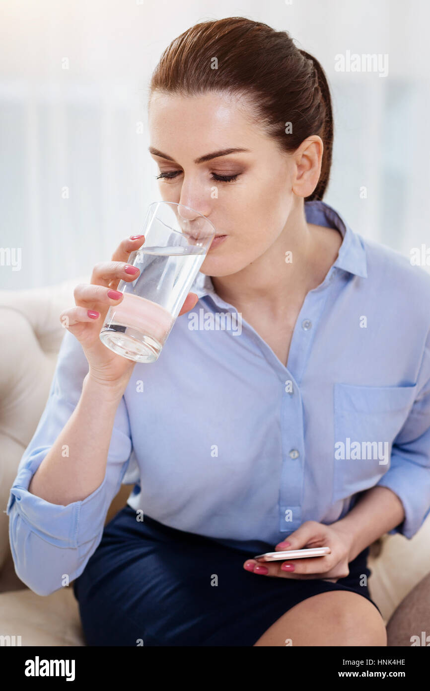 Attractive self employed woman having water Stock Photo