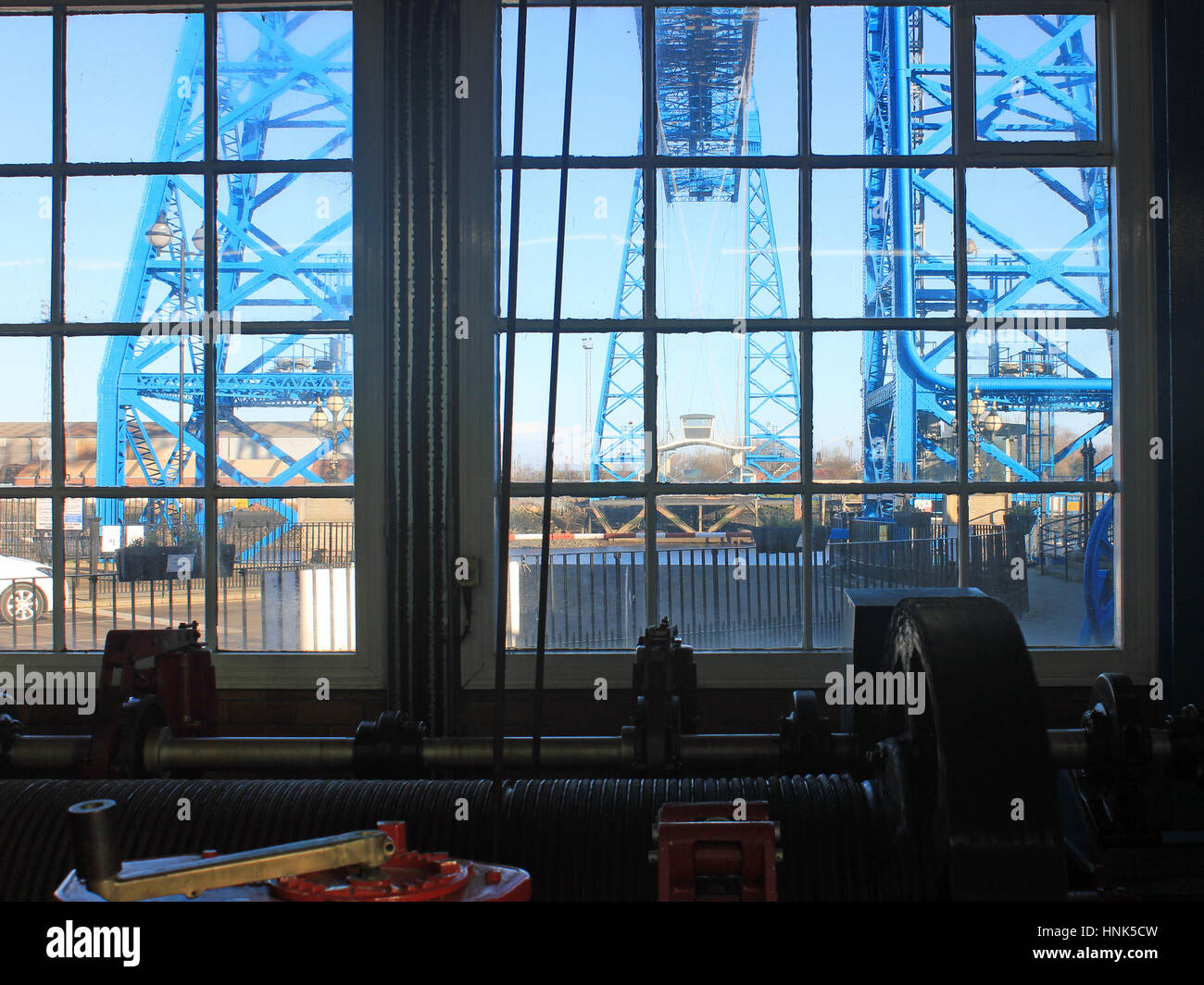 The transporter bridge over the Tees in Middlesbrough seen from the winding house from which the movement of the gondola is driven by electric motors. Stock Photo