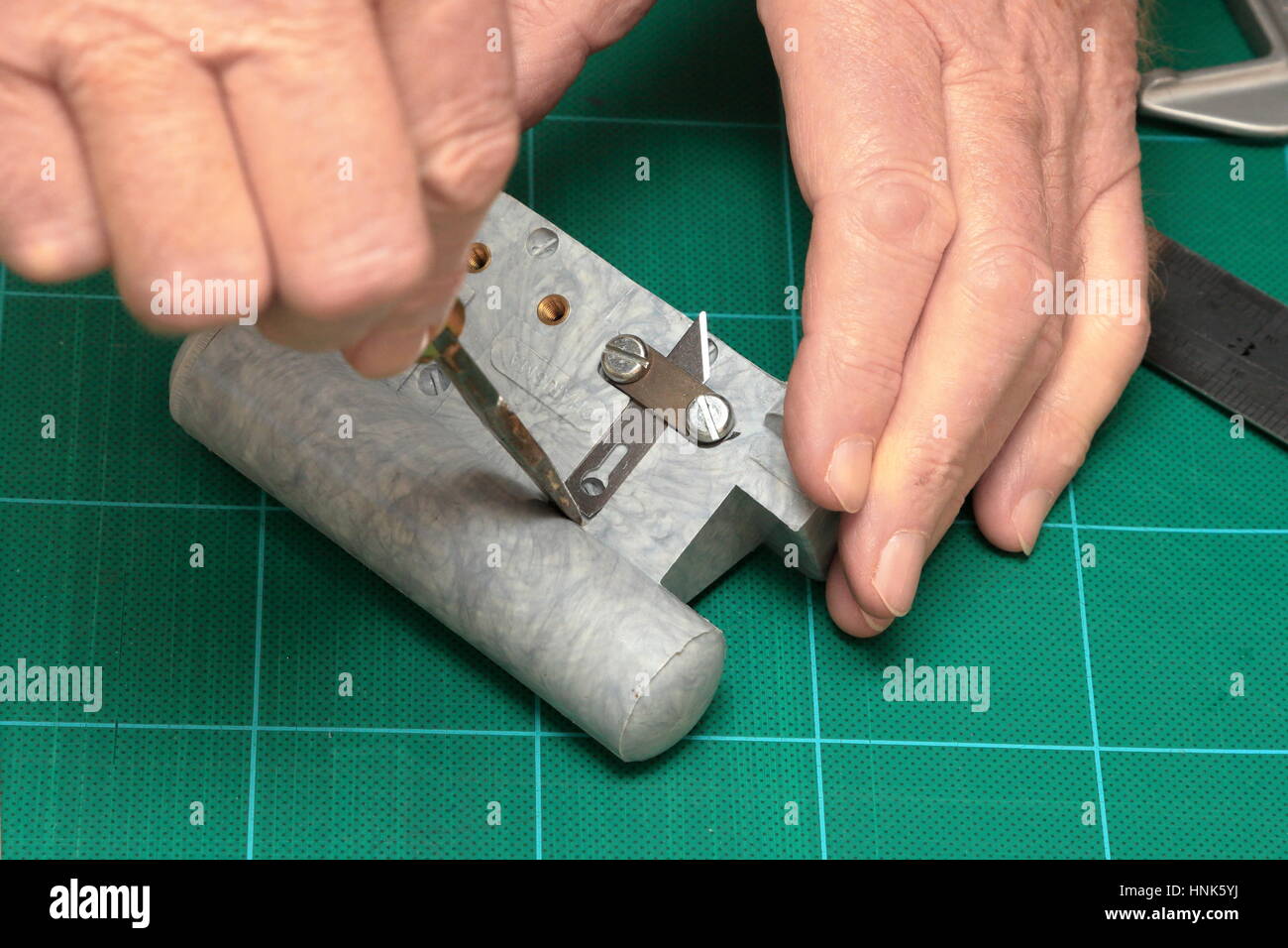 Using a screwdriver to adjust the blade on the Charisma Cushway picture