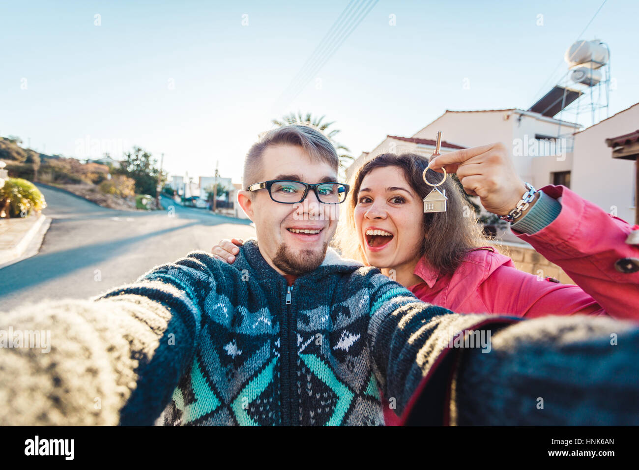 Happy couple showing their new house keys Stock Photo - Alamy