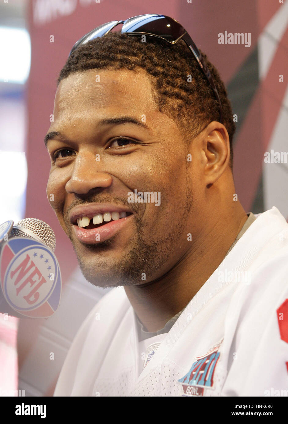 New York Giants' Michael Strahan is interviewed by reporters at Media ...