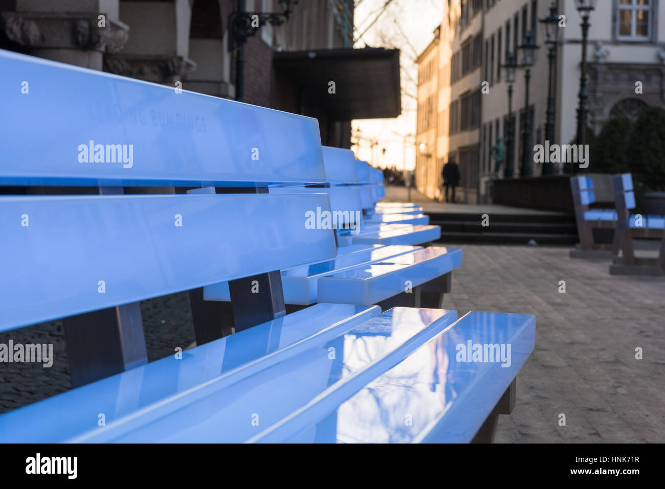 DUESSELDORF, GERMANY - FEBRUARY 13, 2017: Eighteen illuminated benches by the artist Bernd Spiecker decorate the Old market during the city program 'D Stock Photo