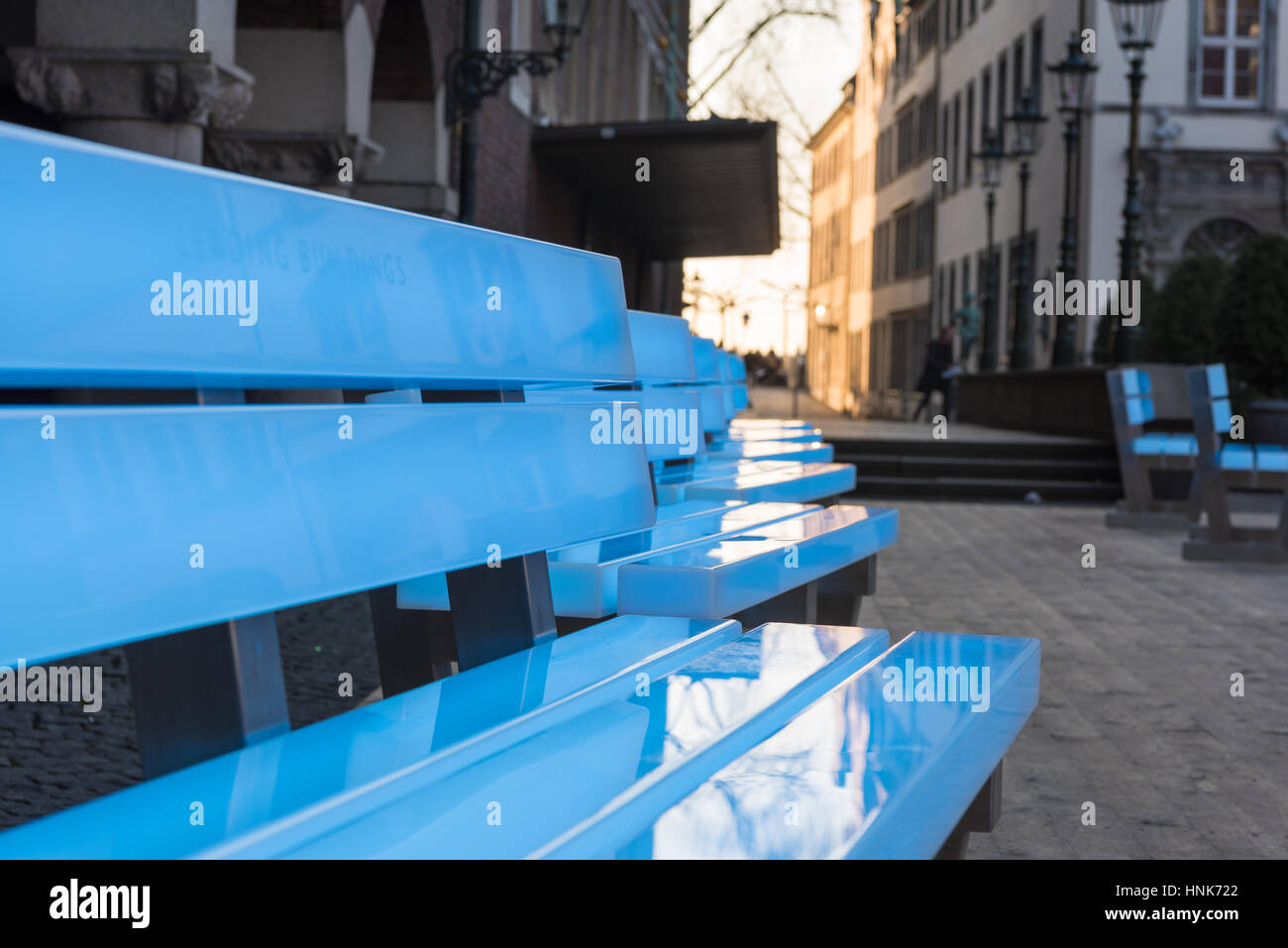 DUESSELDORF, GERMANY - FEBRUARY 13, 2017: Eighteen illuminated benches by the artist Bernd Spiecker decorate the Old market during the city program 'D Stock Photo