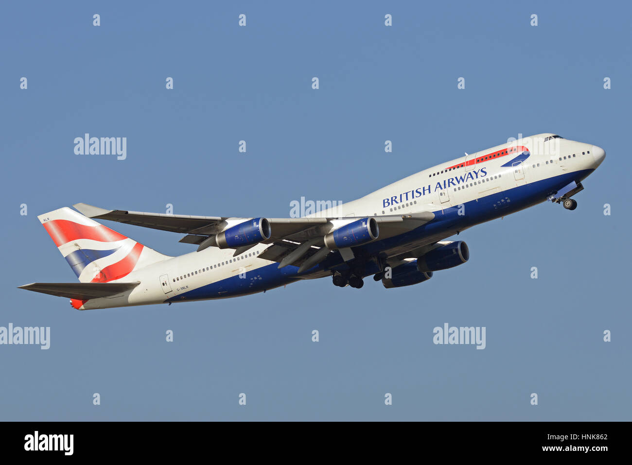 British Airways 747-436 G-BNLN taking off from London Heathrow Airport in blue sky Stock Photo