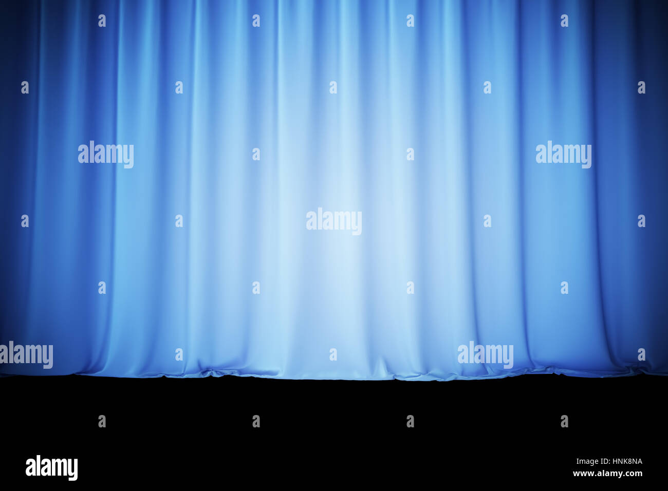 Blue silk curtains for theater and cinema spotlit light in the center. 3d rendering Stock Photo