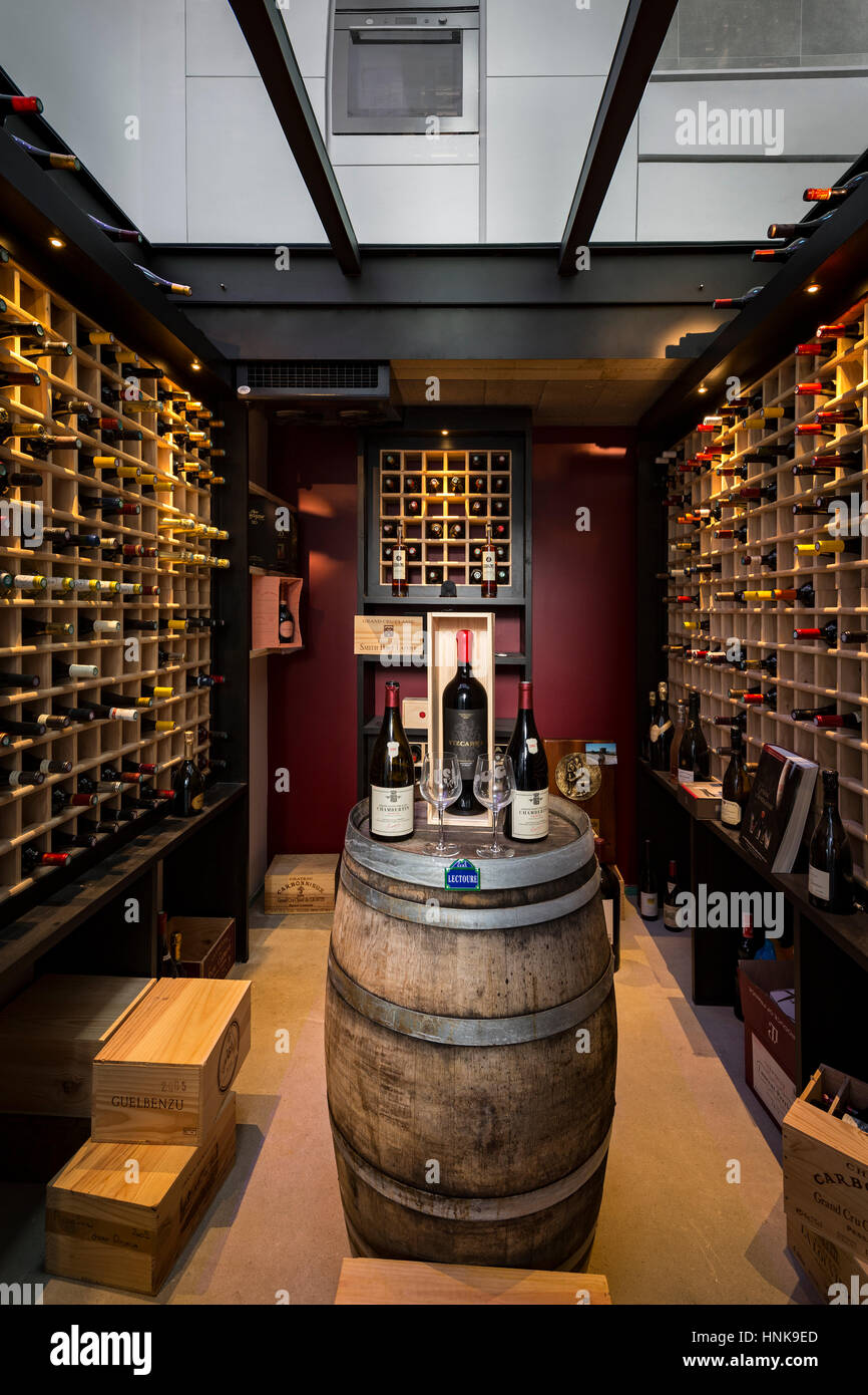 Residential wine cellar. A personal refrigerated wine room, the glass ceiling of which being in fact the floor of the kitchen on top of. Wine room. Stock Photo