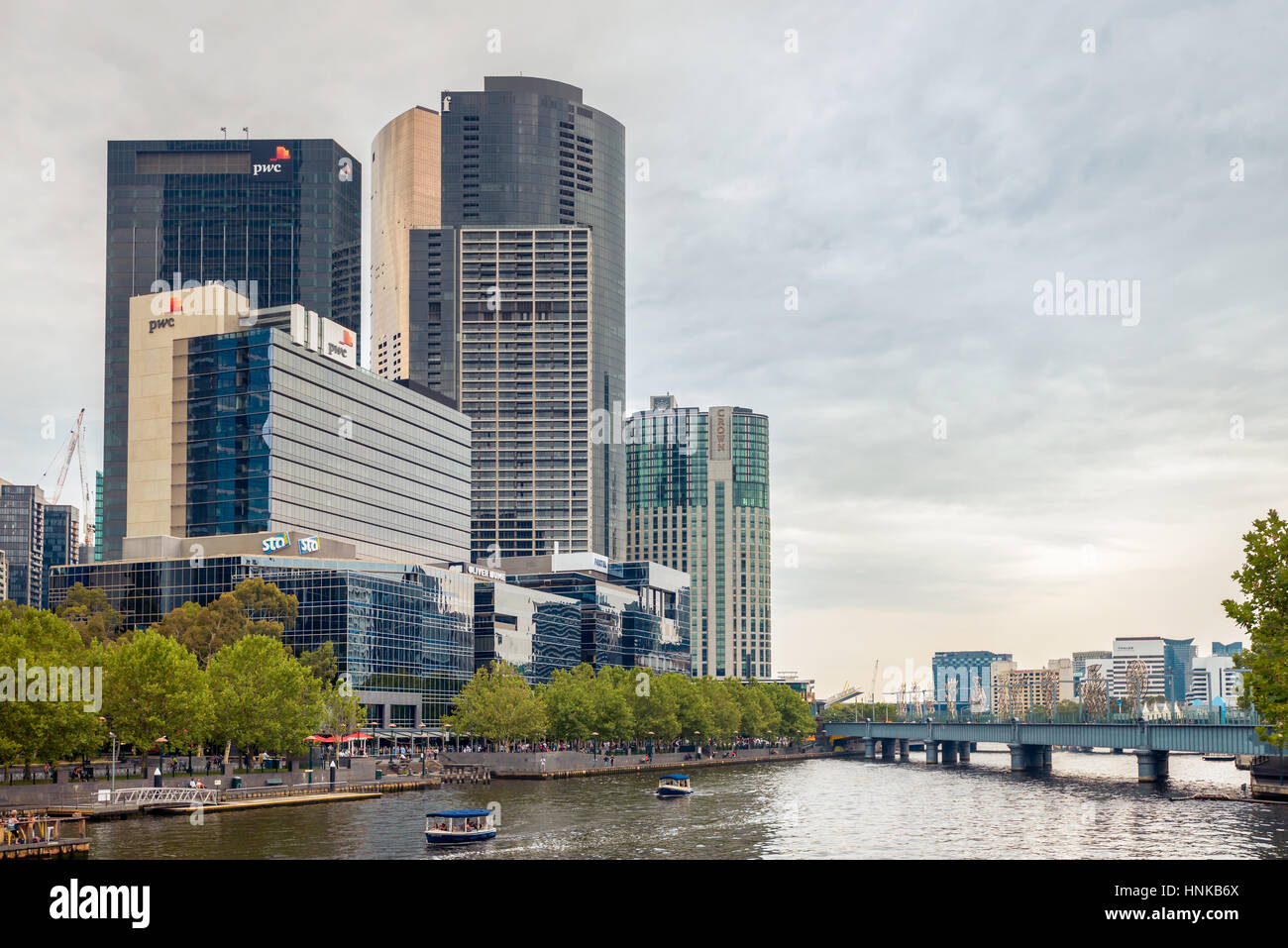 Melbourne, Australia - December 27, 2016: Melbourne city view with people traveling on boats along the Yarra river, Victoria Stock Photo