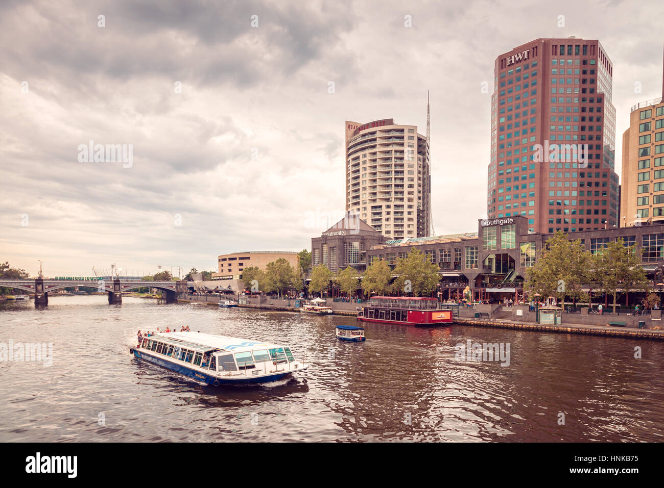 Melbourne, Australia - December 27, 2016: People traveling on Melbourne River Cruises boat along the Yarra river,  Victoria Stock Photo