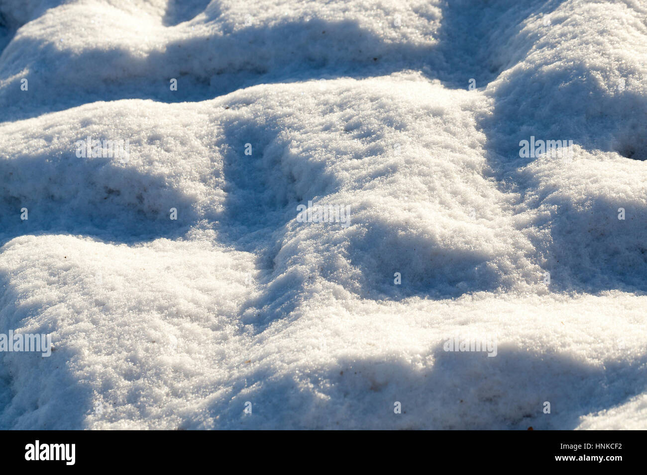 Snow with traces of car Stock Photo - Alamy
