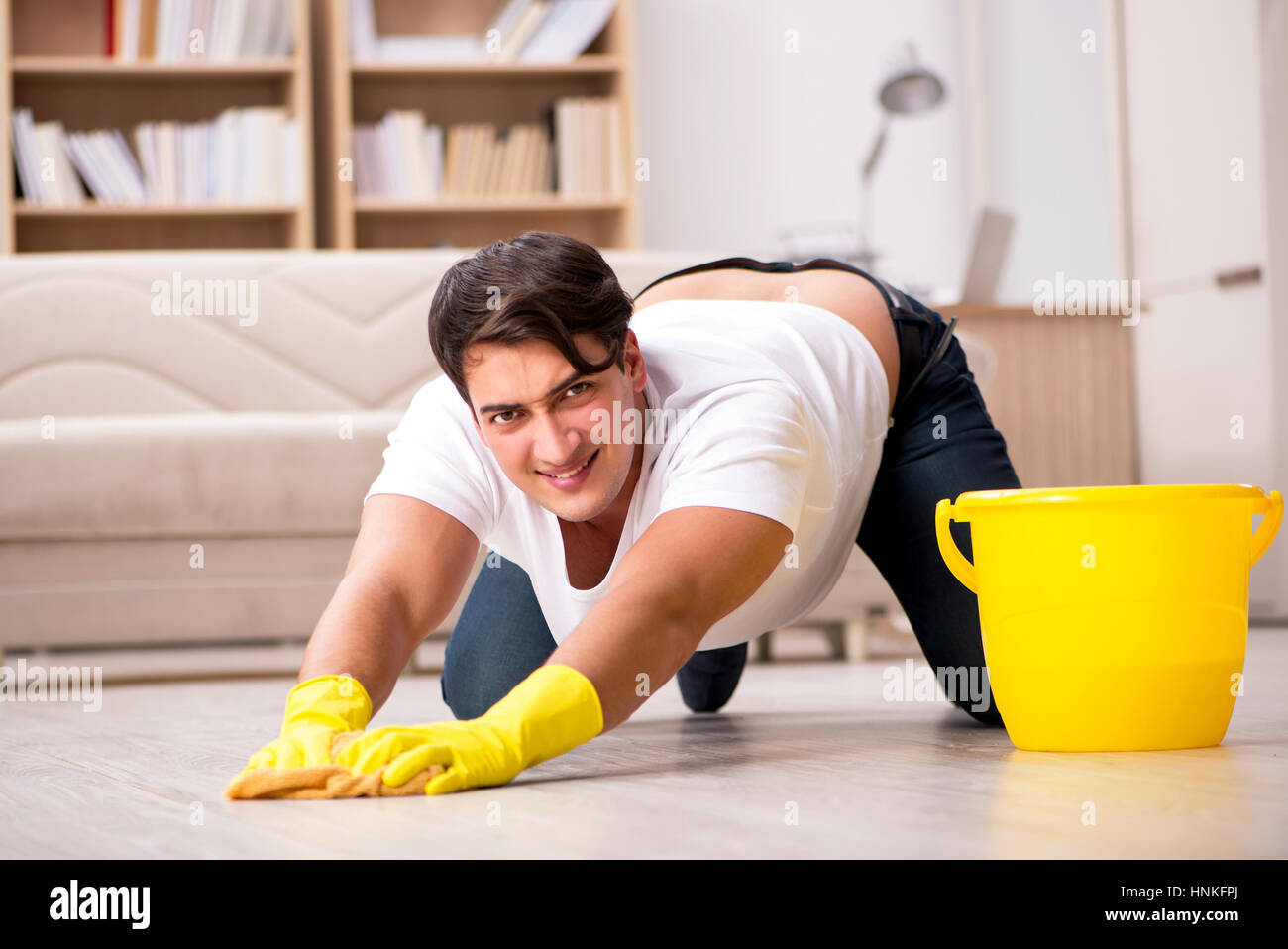 Man husband cleaning the house helping wife Stock Photo - Alamy