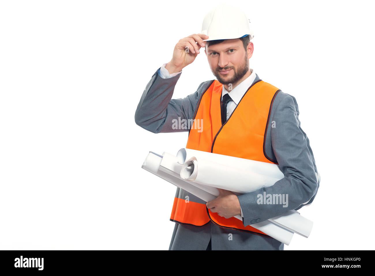Enginee holding safety hat and  many  plans of buidings. Stock Photo