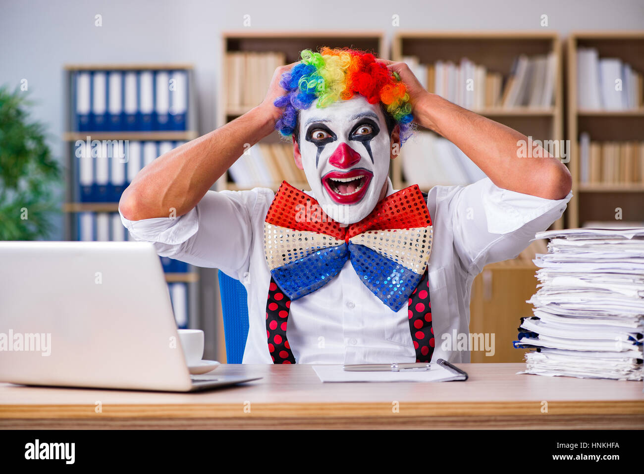 Work Cloan Clown businessman working in the office Stock Photo - Alamy