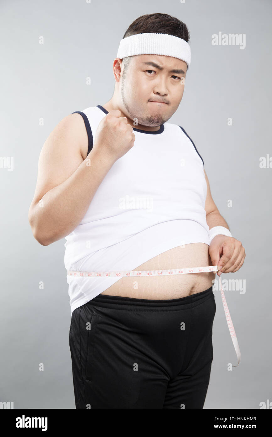Fat young men lose weight Stock Photo