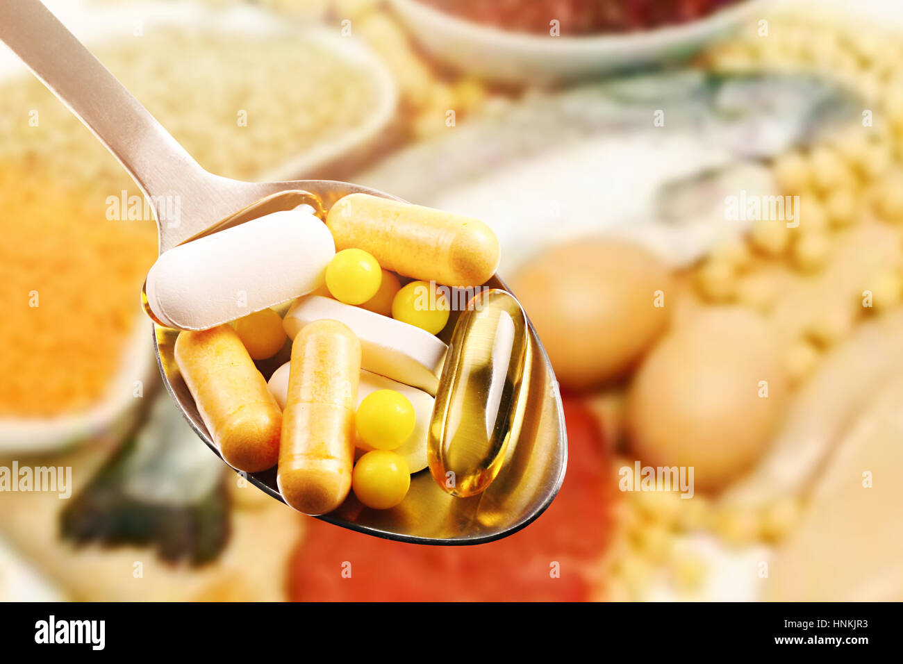 dietary supplements in spoon on protein food background Stock Photo