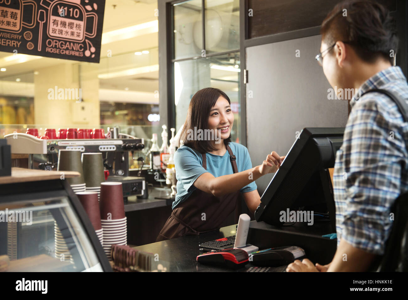 Cafe cashier and customer Stock Photo Alamy