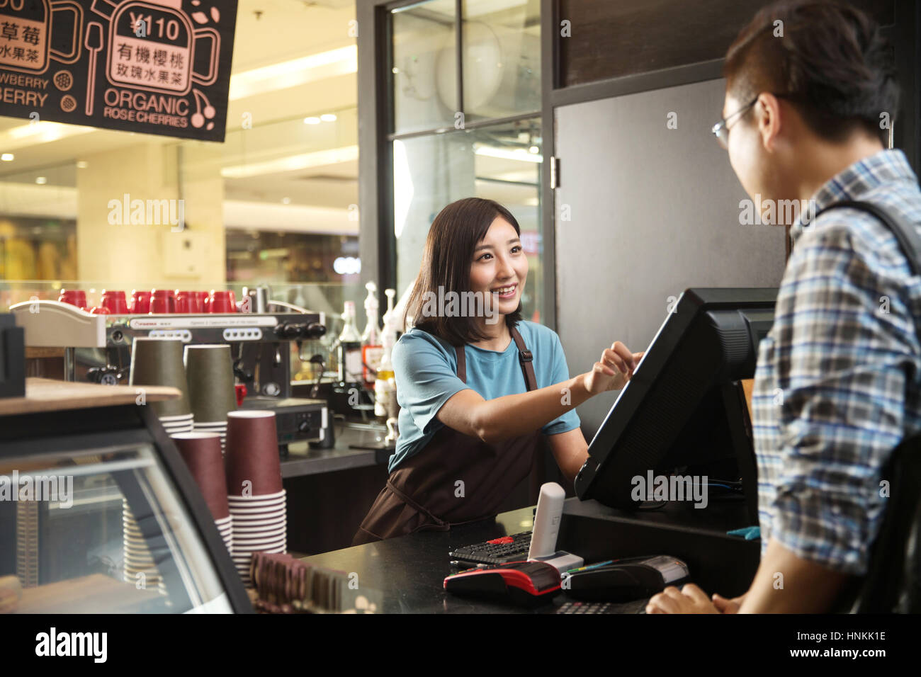 Cafe cashier and customer Stock Photo