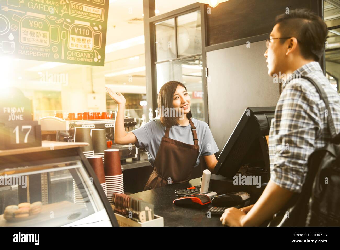 Cafe cashier and customer Stock Photo