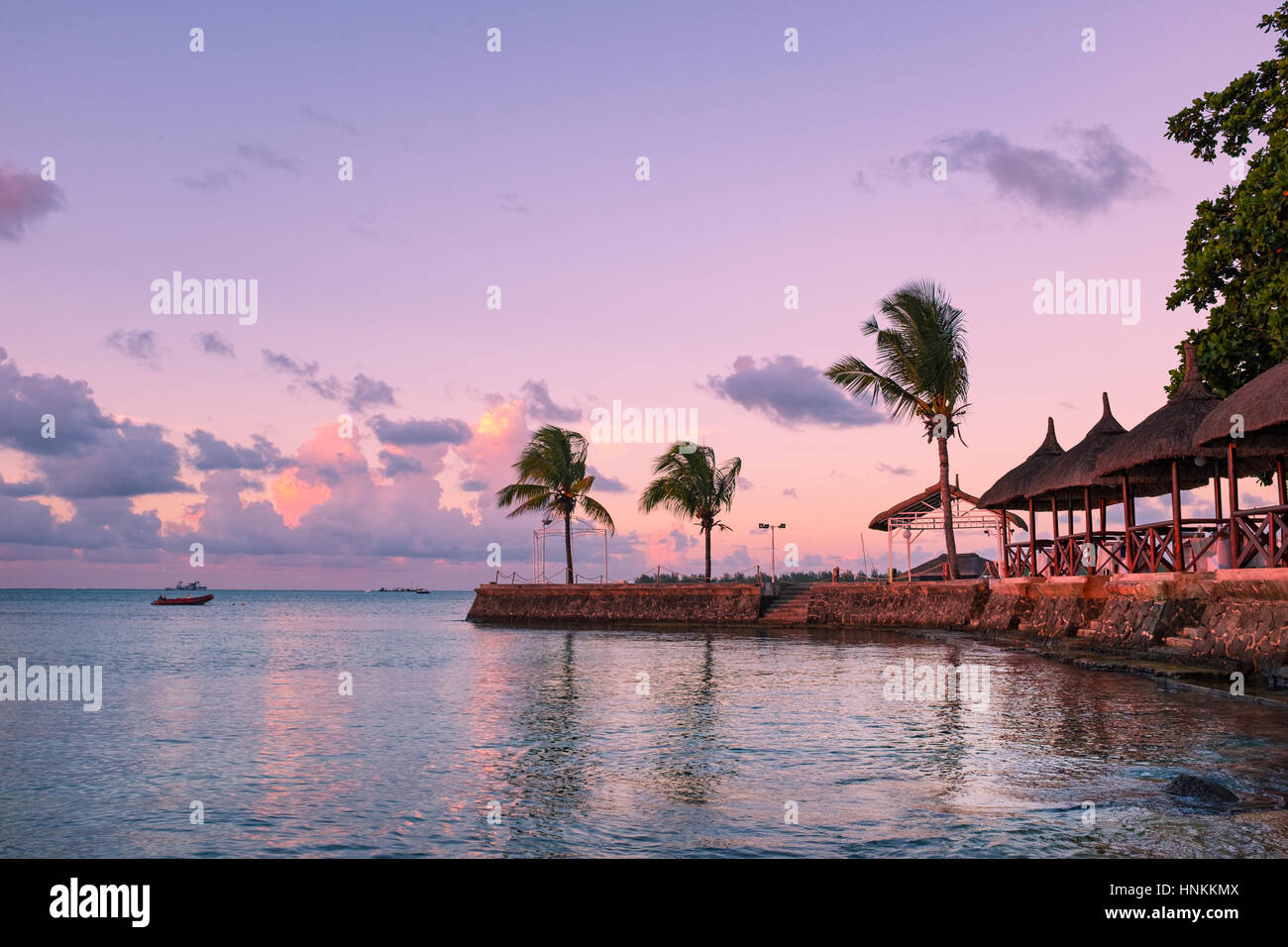 Beautiful  sandy beach  at sunset. Mauritius.  Stock Photo
