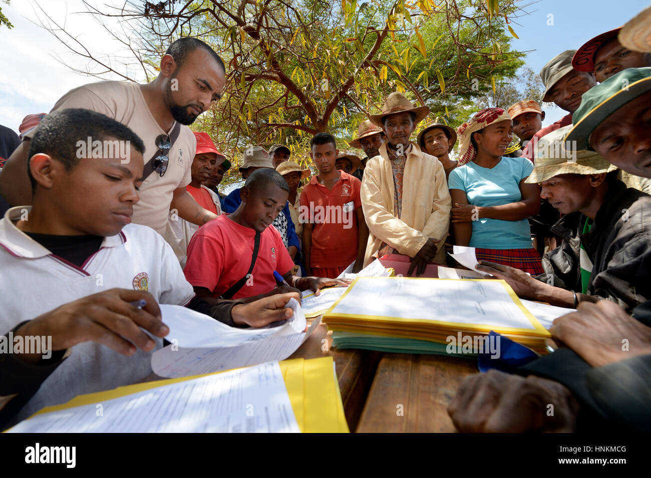 Villagers fill out applications for certification of their land on the village square, Analakely village, Tanambao commune Stock Photo