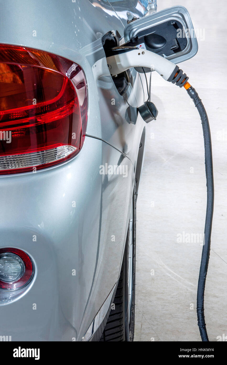 Electric vehicle charging Stock Photo Alamy