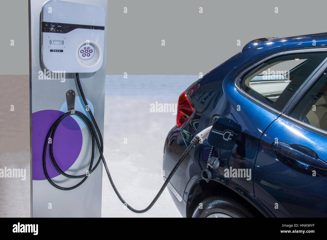 Electric vehicle charging Stock Photo Alamy