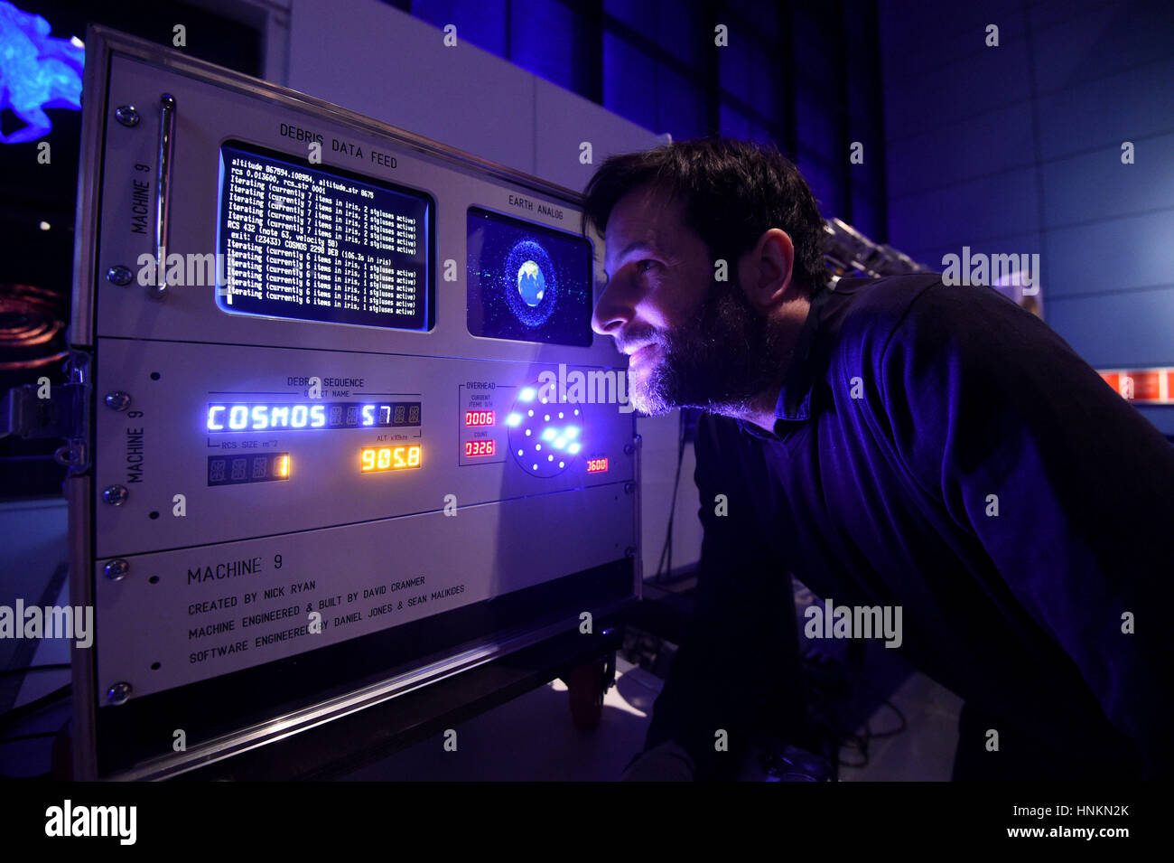 Creator Nick Ryan examines Machine 9, an electromechanical sound instrument that transforms the movement of 27,000 pieces of space junk into sound in real time, is put on display at the Science Museum in London. Stock Photo